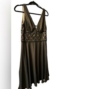 Black dress with tan undertone and lace band and V neck and sleeveless Size 12